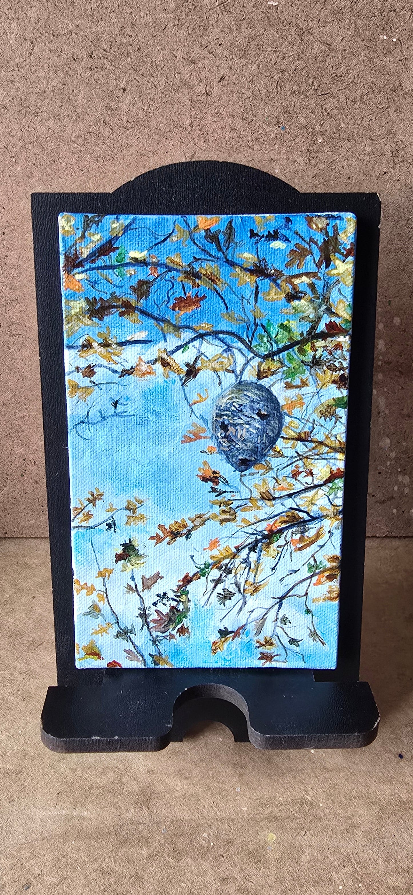 Decorative tray with a nature-themed design on a textured surface