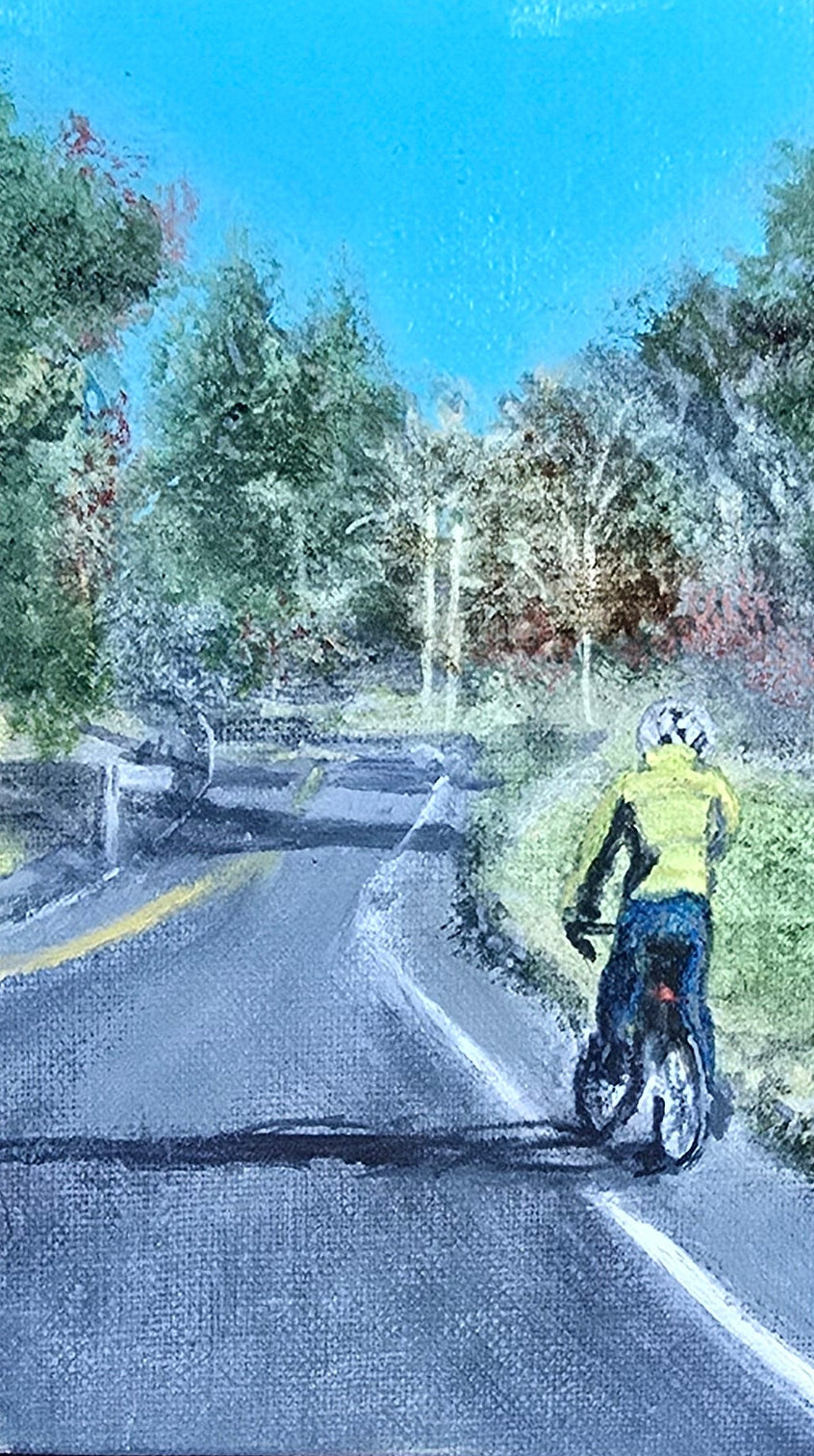 Phone screen displaying a video of a person walking on a road with trees and buildings in the background, placed on a textured surface.