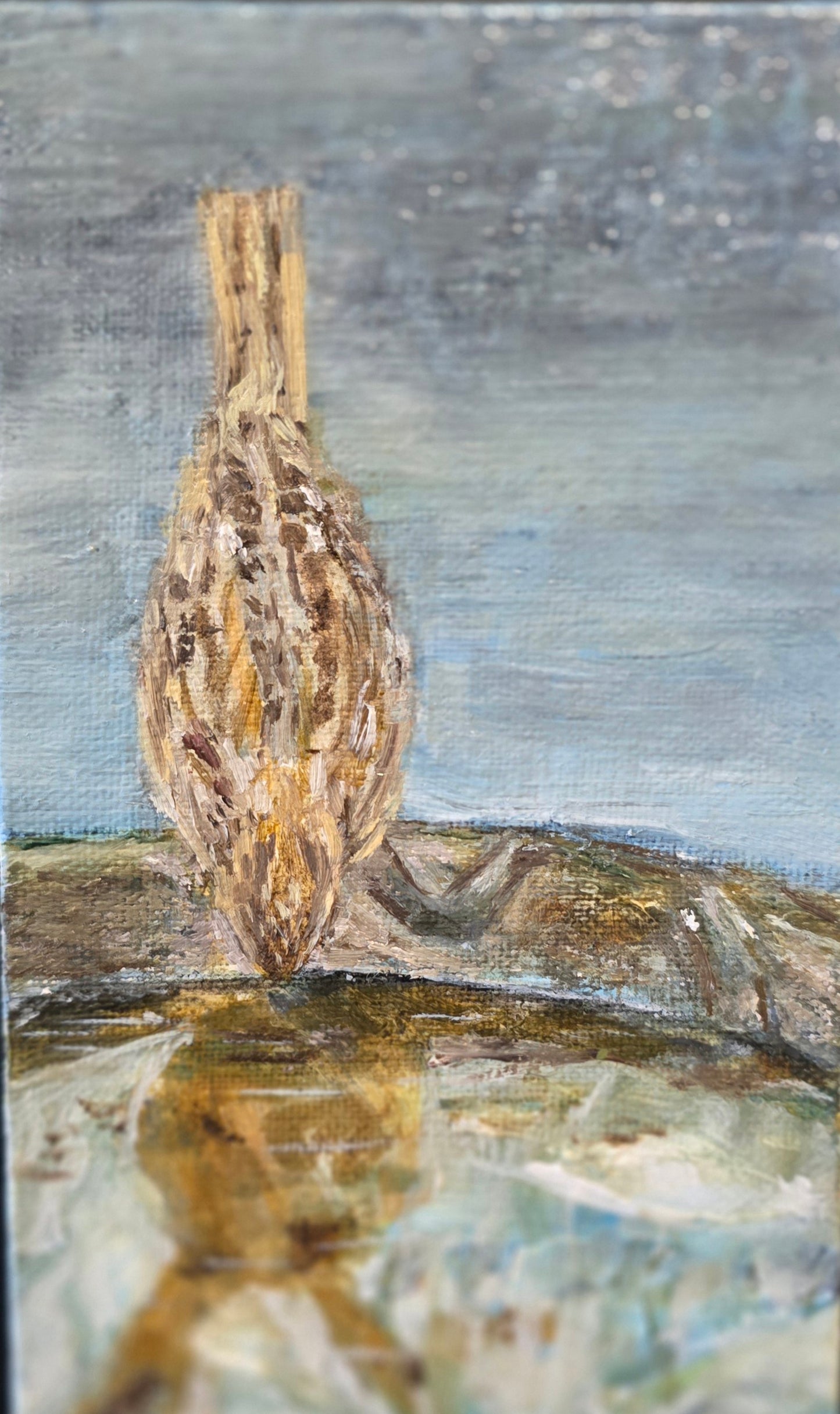 Artistic depiction of a bird on a branch with a reflective water surface below